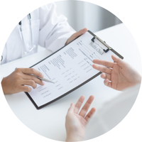 Medical professionals reviewing information on a clipboard